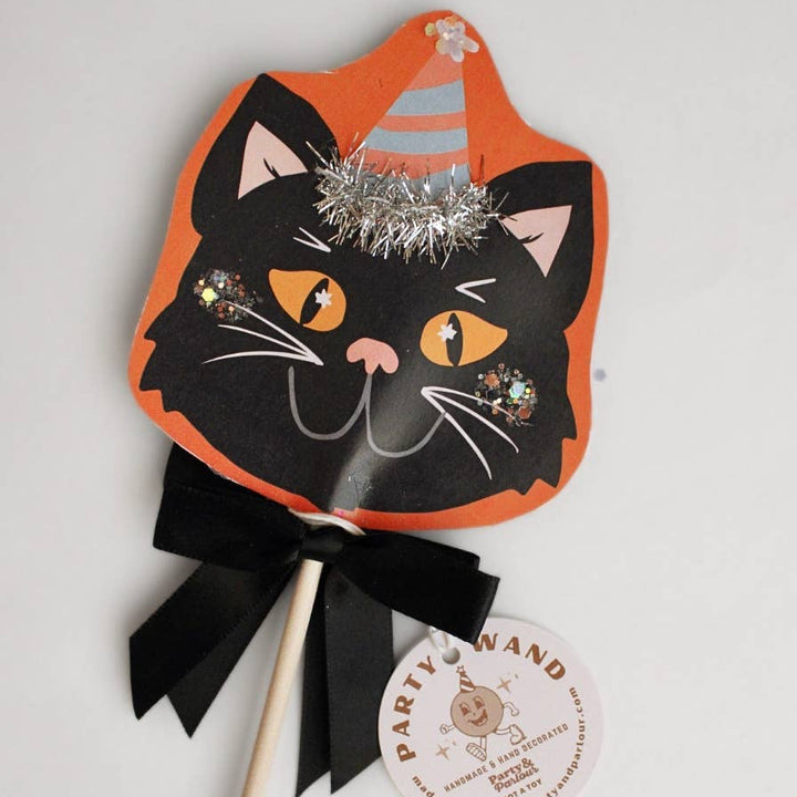 Black cat Halloween party wand with glitter, party hat, silver tinsel, and black satin bow for Halloween table decor