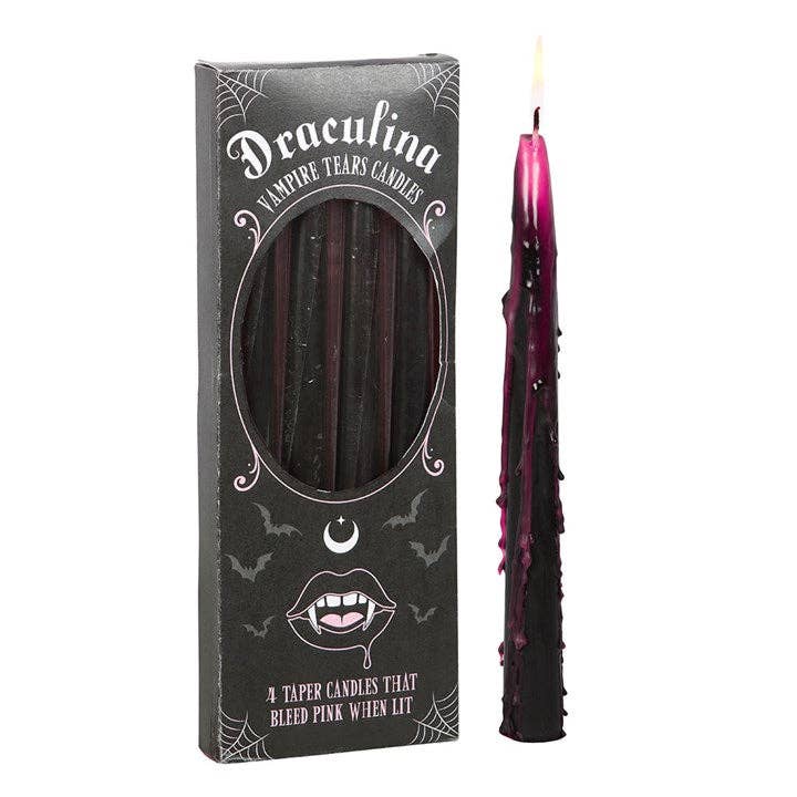Draculina box with a black taper candle dripping magenta pink wax, girly gothic decor for Halloween