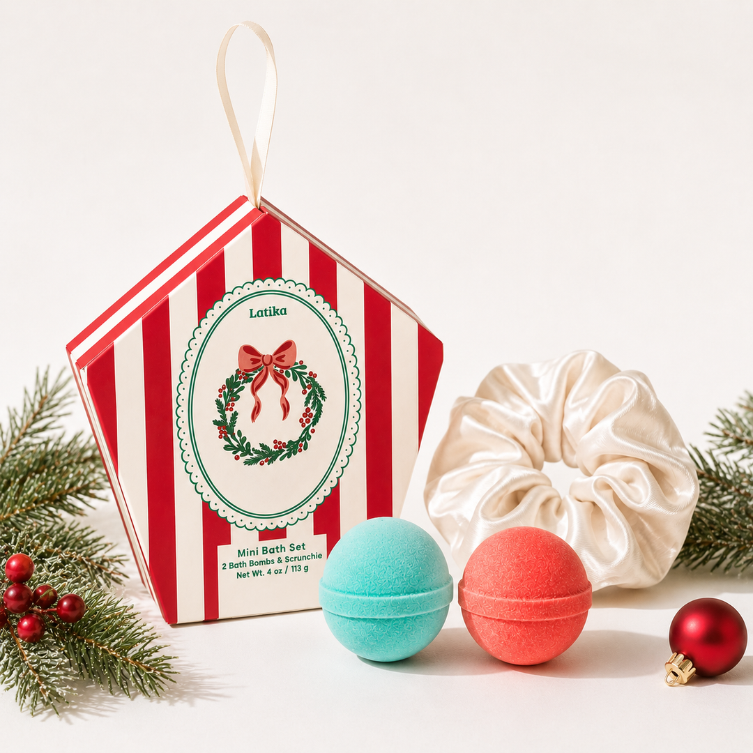 Red striped ornament box with wreath crest, aqua and coral mini bath bombs and ivory scrunchie, a Christmas set