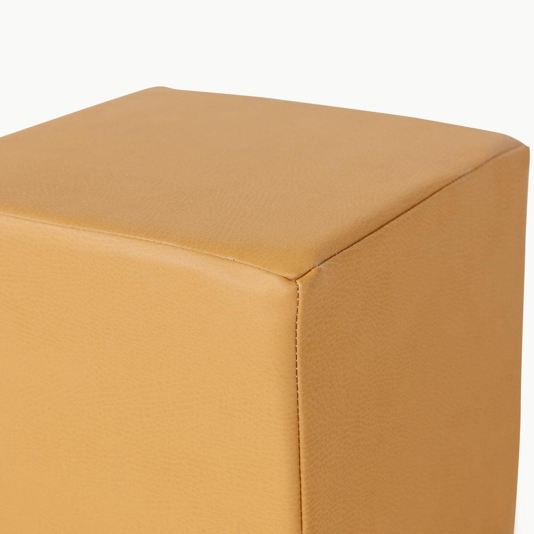 Camel vegan leather foam play cube, close-up of the wipeable stitched surface.