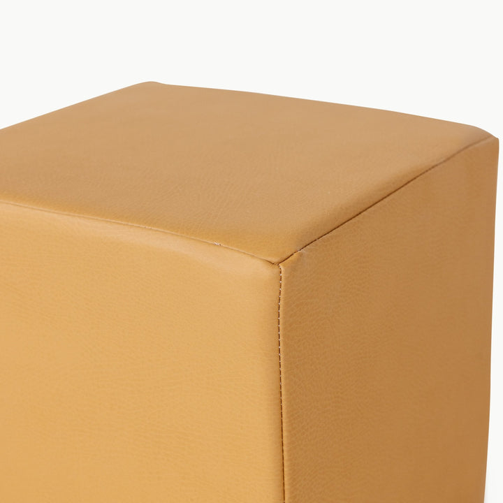Camel vegan leather foam play cube, close-up of the wipeable stitched surface.