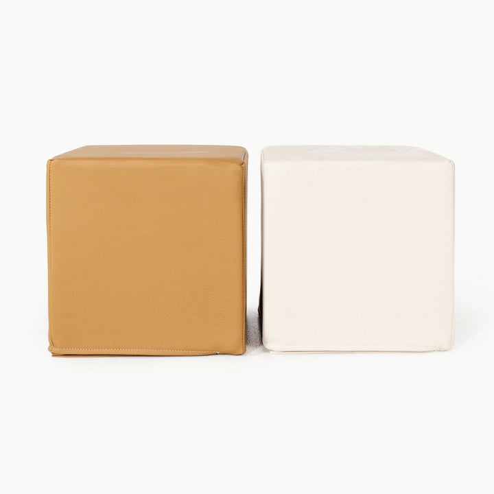 Camel and ivory vegan leather foam play cubes side by side for stacking and sitting.
