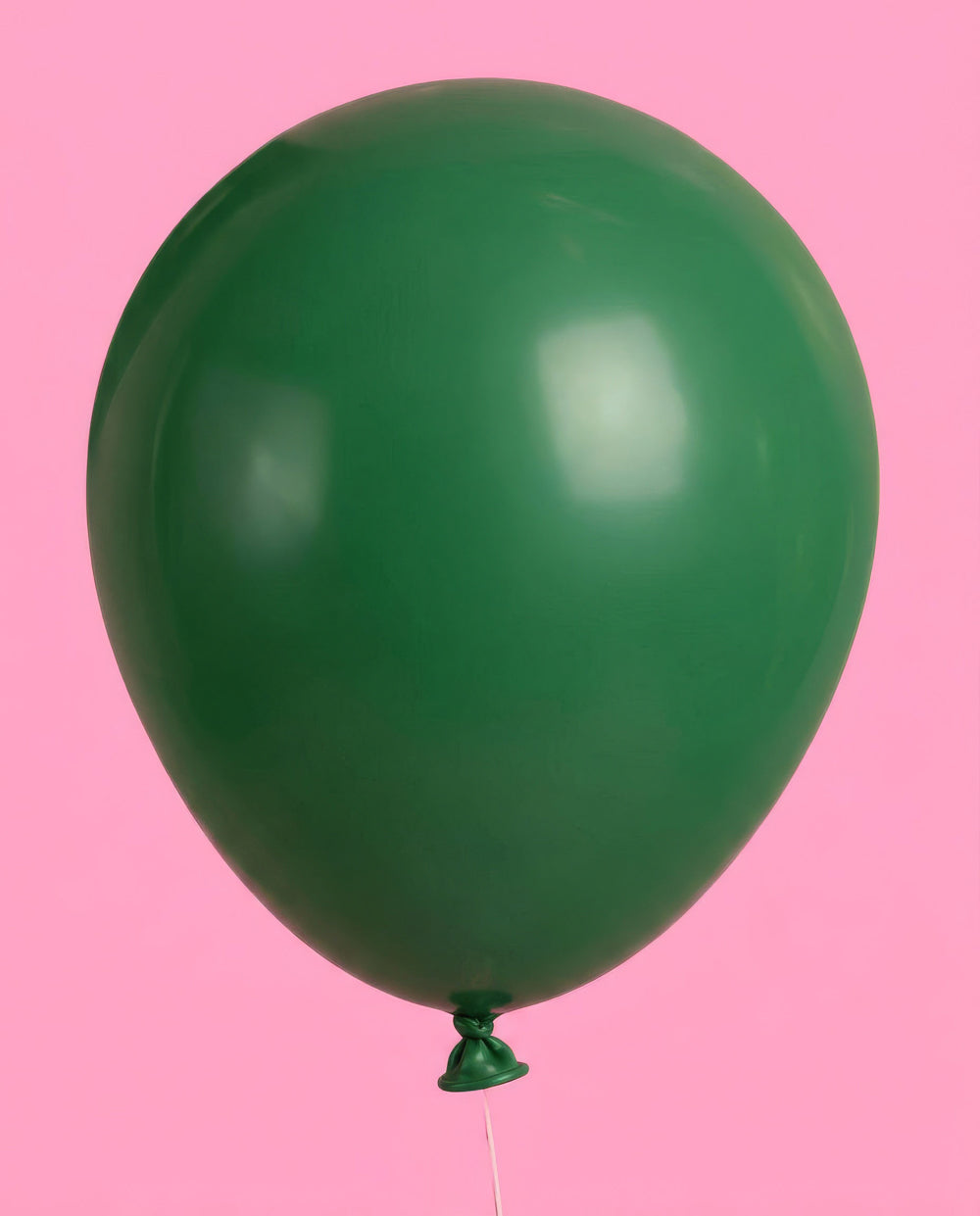 Bunch of glamping camp latex balloons against a pink backdrop