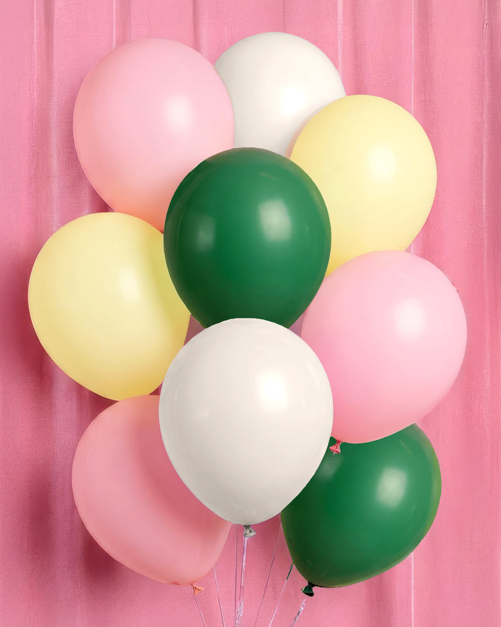 Bunch of camp latex balloons in light pink, white, yellow, and dark green
