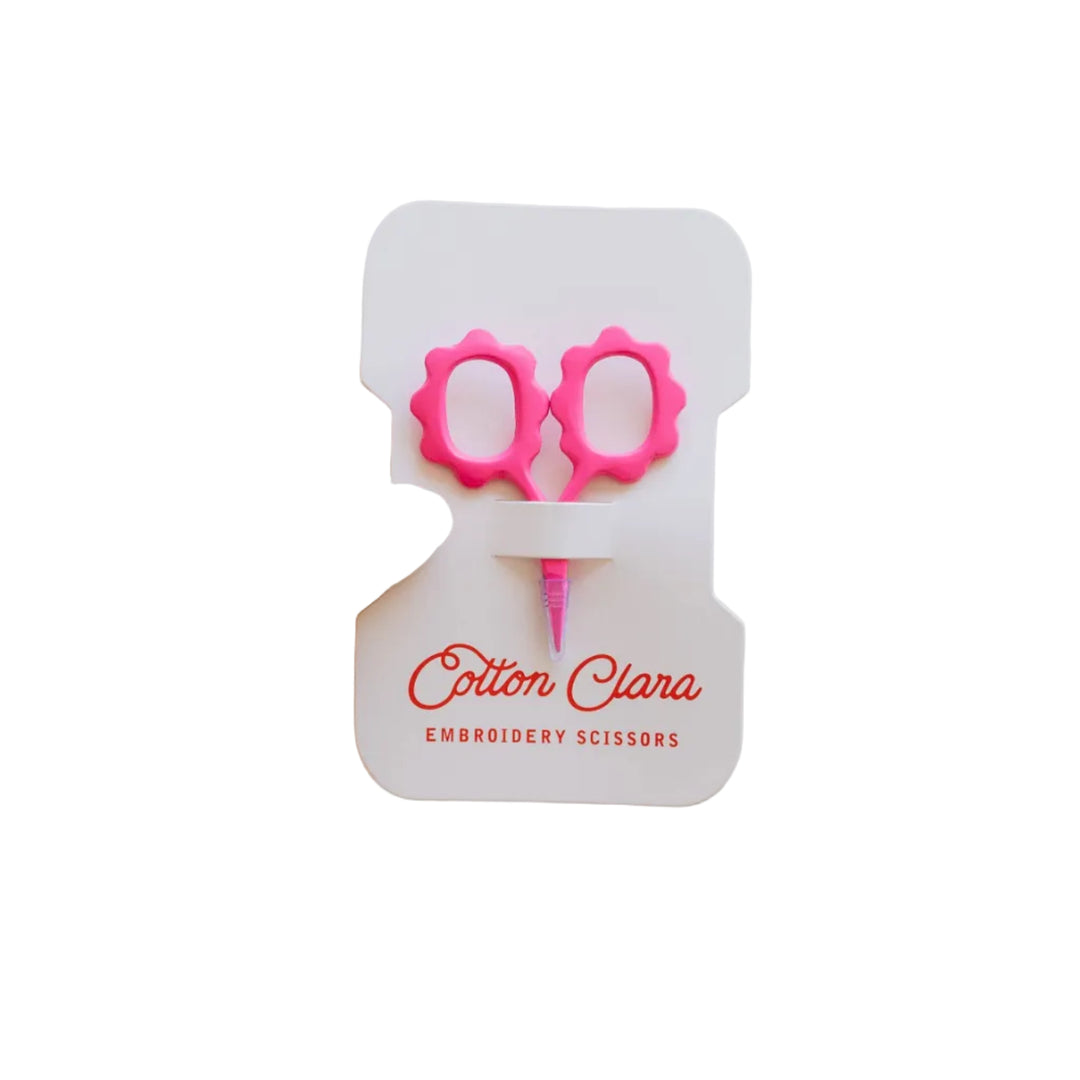 Bright pink mini sunflower embroidery scissors on a Cotton Clara bobbin card