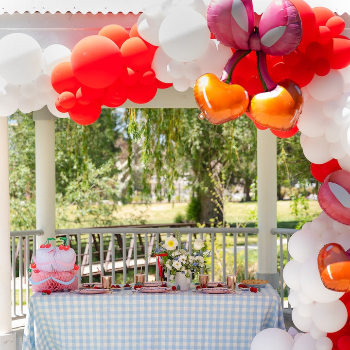 Meri Meri Honeycomb Birthday Cake decoration at a Bonjour Fete cherry pie gingham summer party with balloons