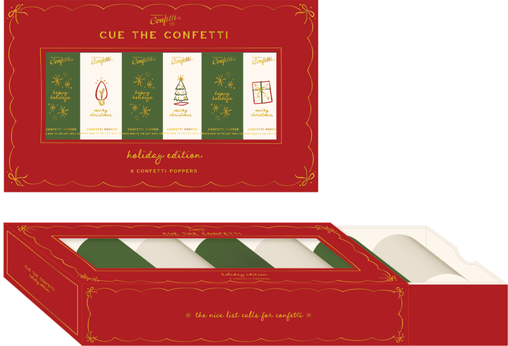 Flat lay of the red holiday box with six Christmas confetti poppers laid out below it