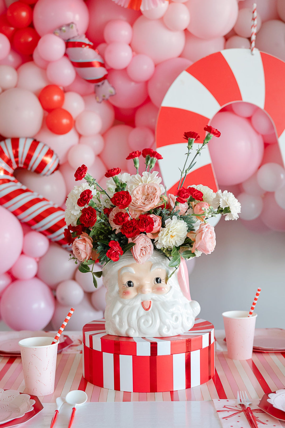pink santa vase and santa themed christmas decorations