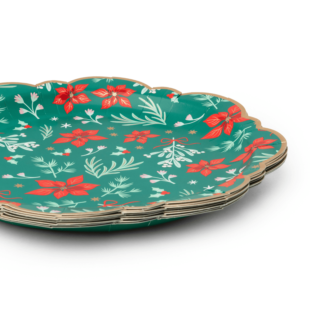 Stack of green Christmas floral dinner plates showing the classic rim design