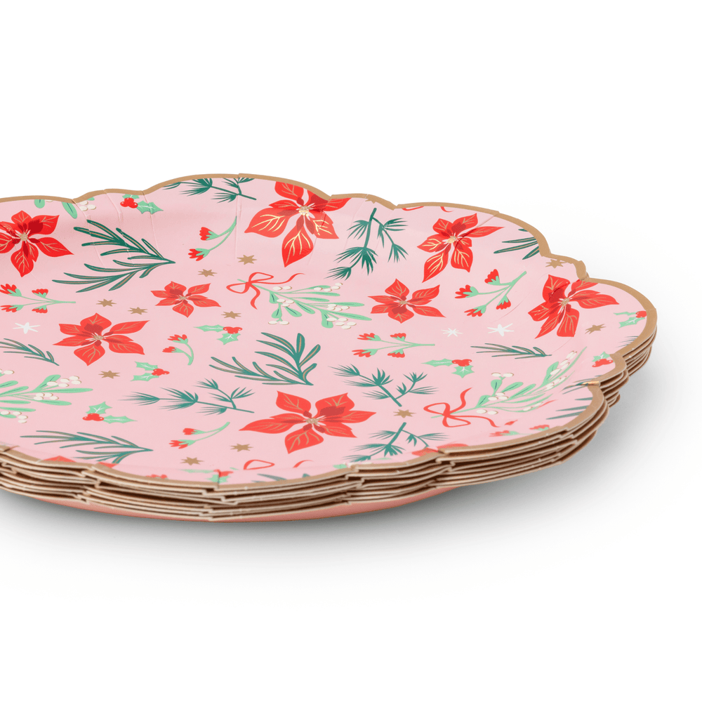 Stack of pink Christmas floral dinner plates showing the classic rim design
