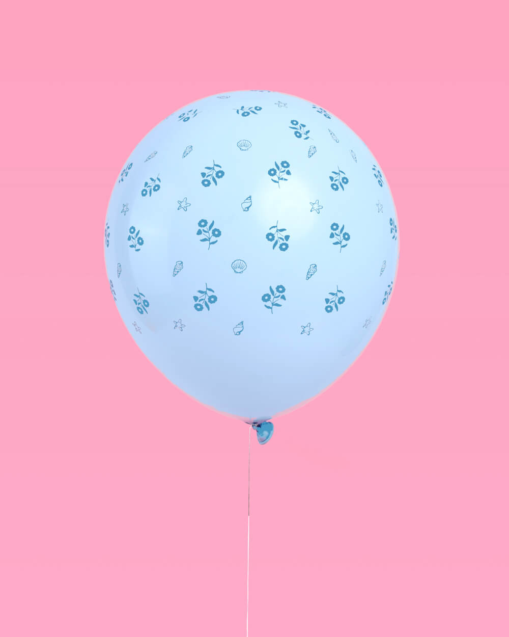 Bunch of coastal blue latex balloons against a soft backdrop