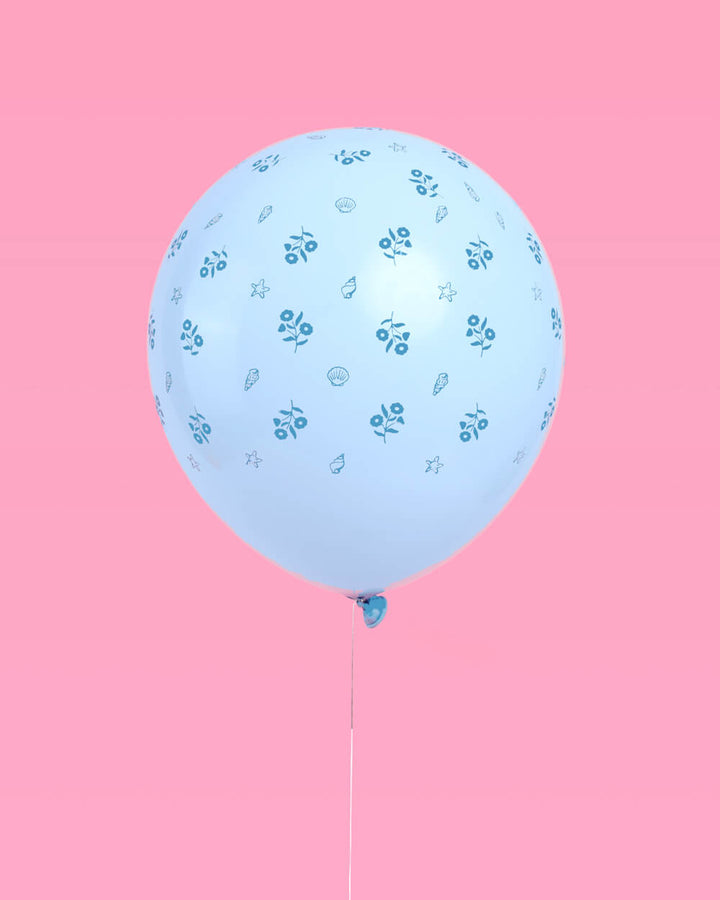 Bunch of coastal blue latex balloons against a soft backdrop