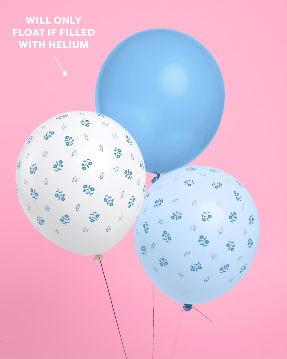 Close-up of white coastal latex balloons with a delicate blue floral print