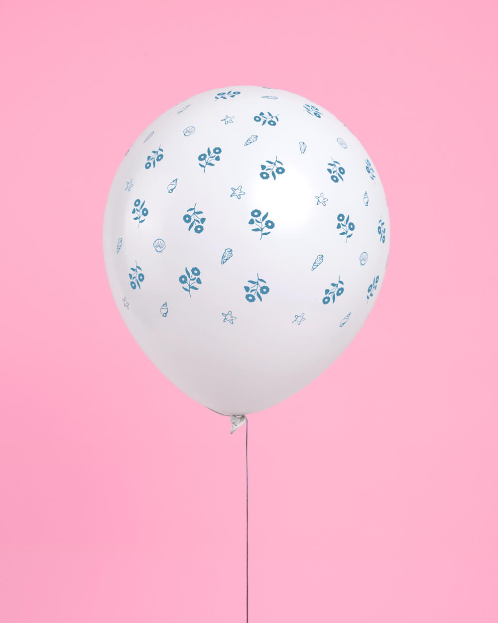 Coastal blue latex balloons arranged for a beach birthday or coastal baby shower
