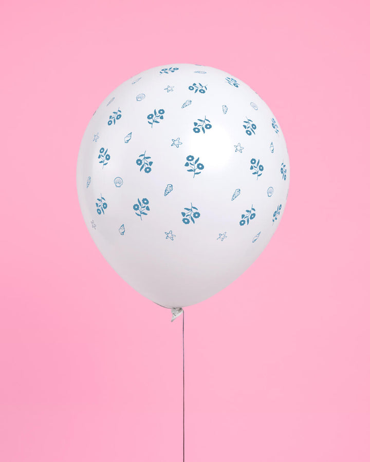 Coastal blue latex balloons arranged for a beach birthday or coastal baby shower