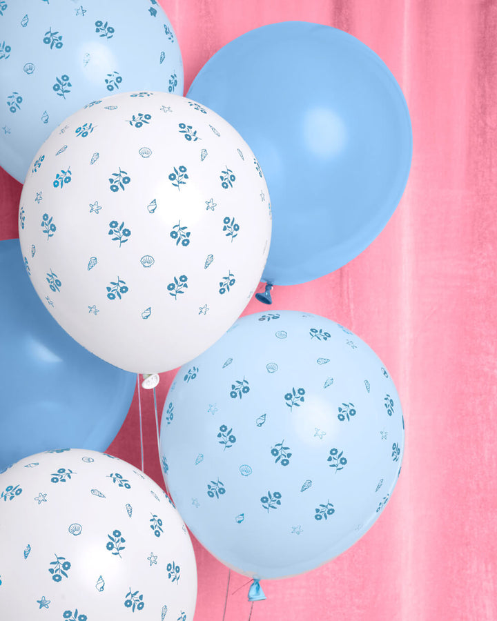 Coastal latex balloon set in solid blue, white, and light blue with a blue floral print