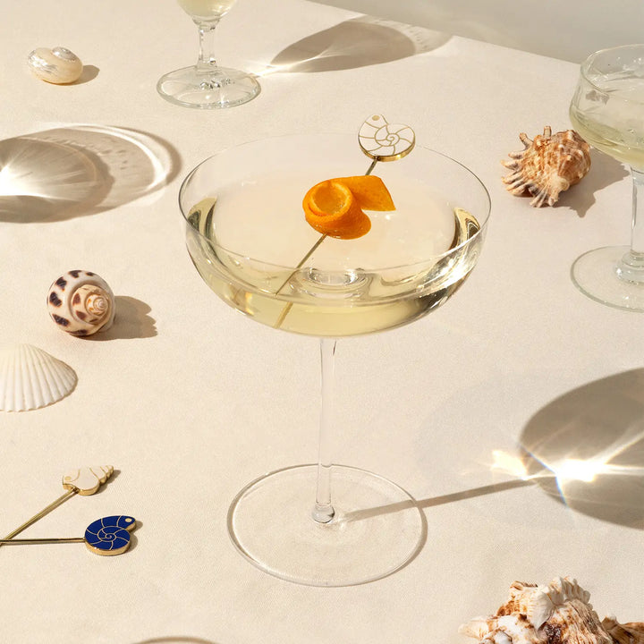 Pearl shell cocktail picks by 54Celsius, a set of four gold plated picks for appetizers or a coastal themed cocktail party