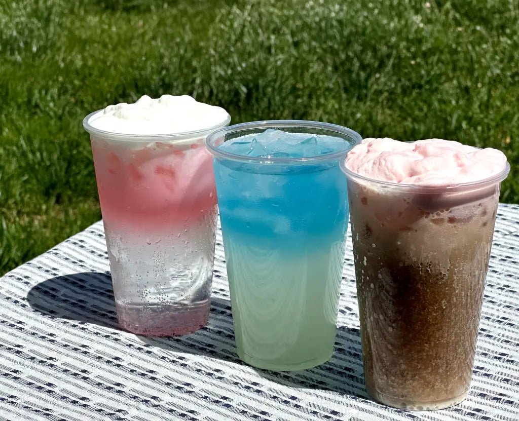 Close-up of berry cold foam layered over iced coffee
