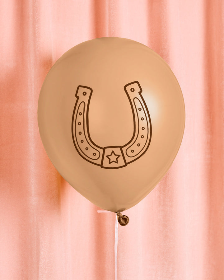 Single brown cowboy latex balloon with a cowboy boot print