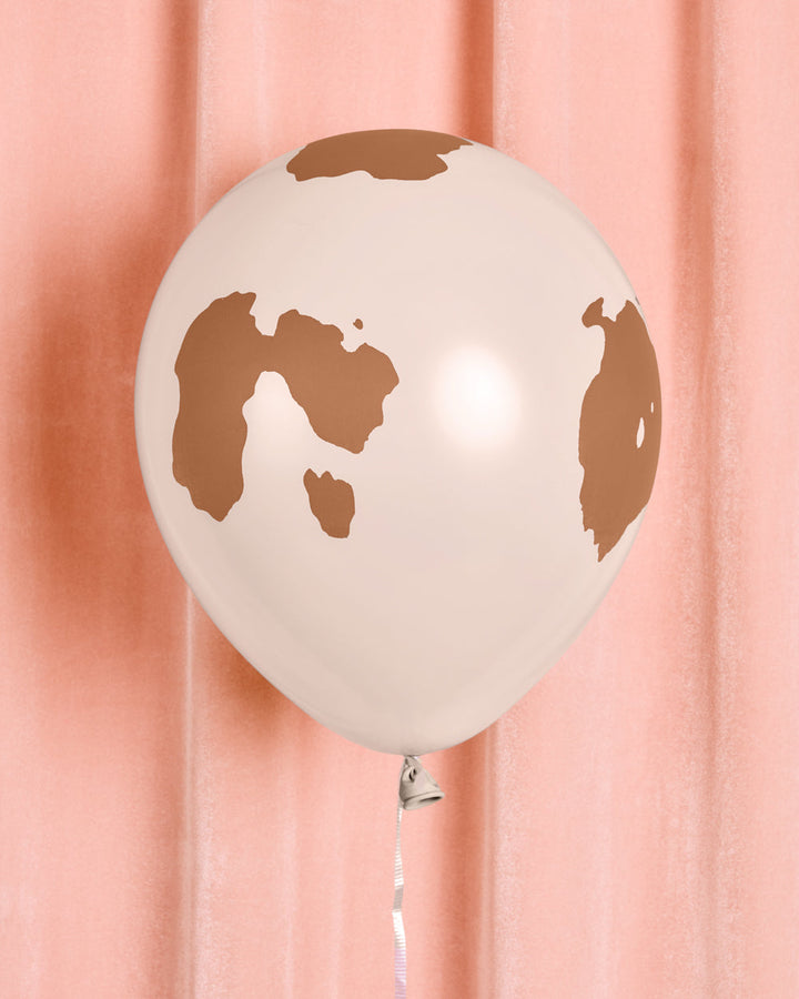 Single white cowboy latex balloon with a green cactus print
