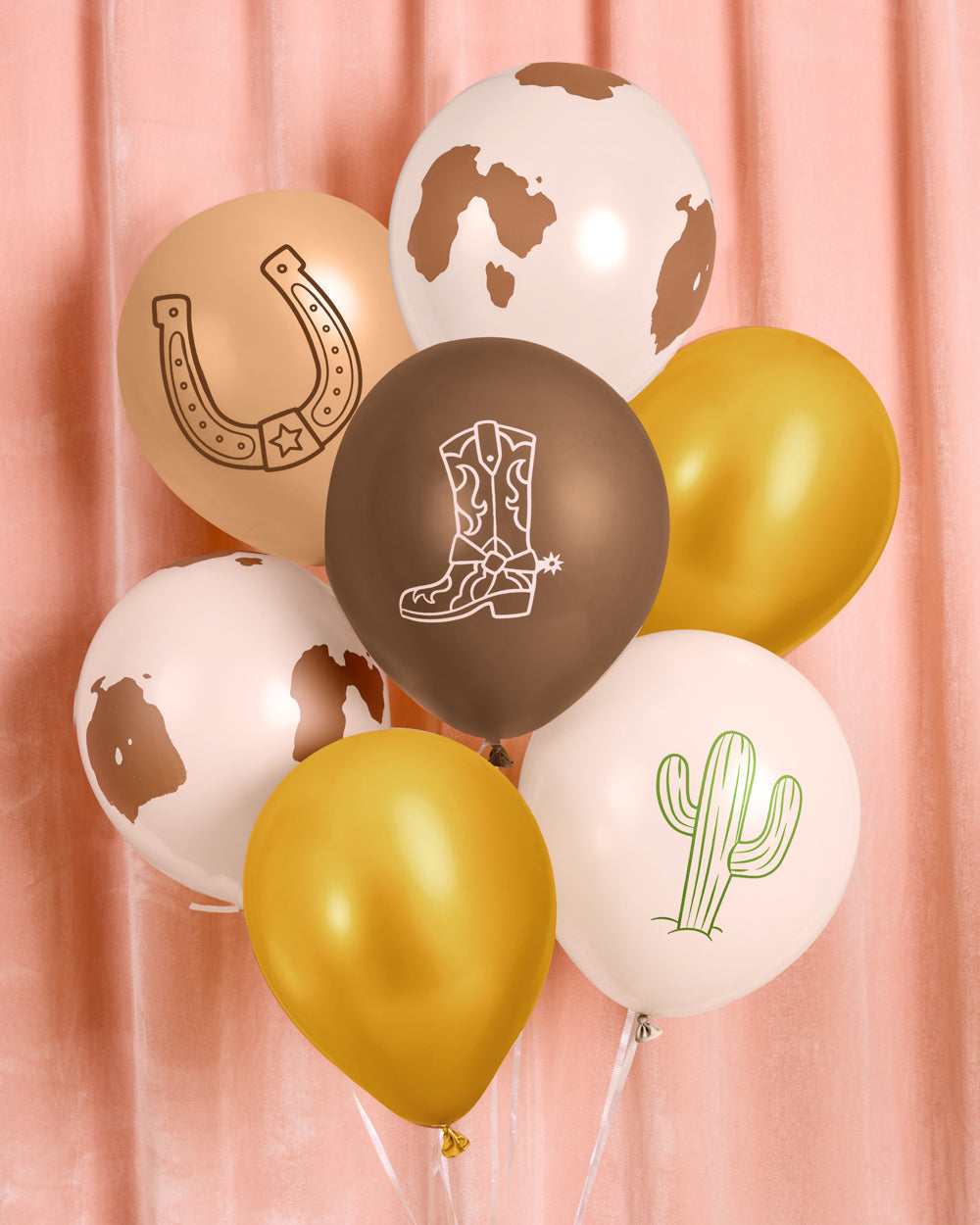 Bunch of cowboy latex balloons with cow print, gold, cowboy boot, horseshoe, and cactus designs