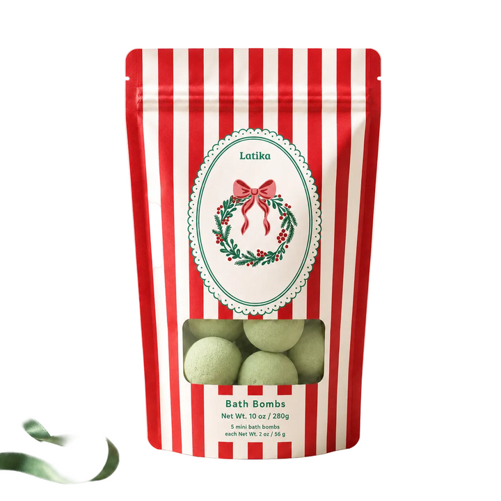 Red striped pouch with a window of green mini bath bombs, a pine and cedarwood Christmas treat