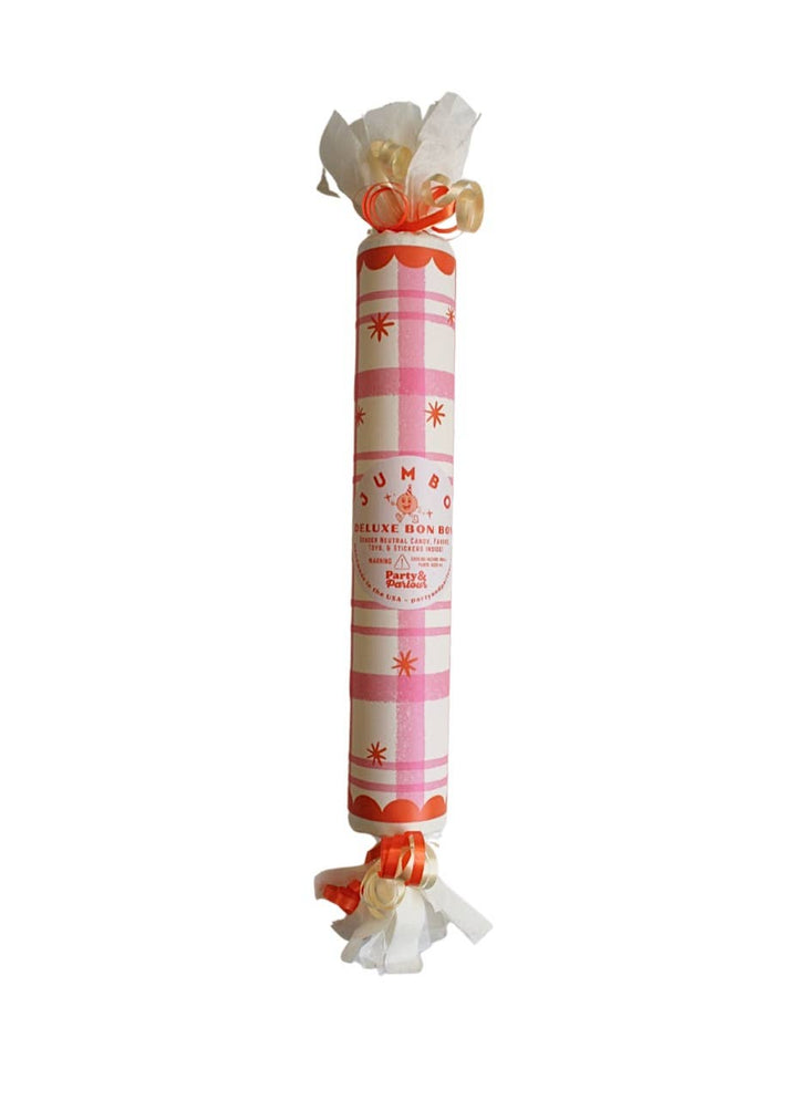 Pink plaid jumbo surprise bon bon with orange stars and scalloped trim for a birthday party table