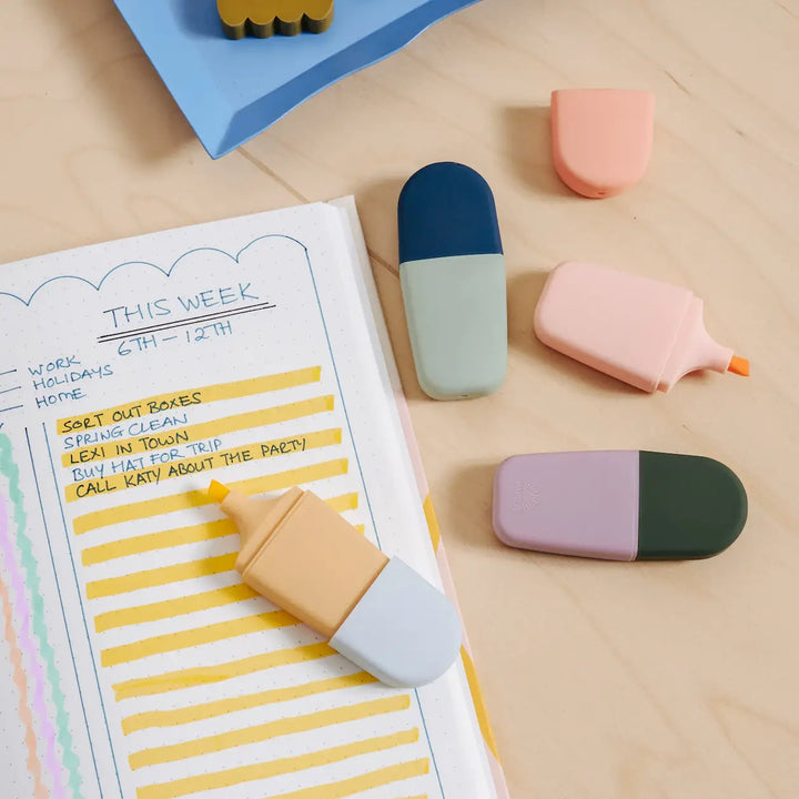 Mini highlighters marking a weekly planner list in yellow, showing soft shades that lift notes for study sessions