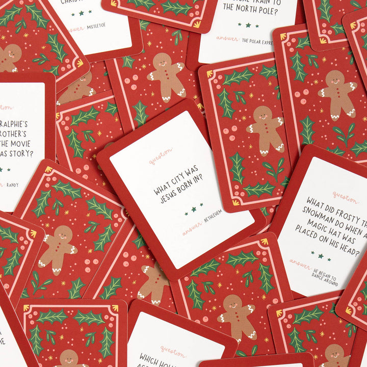Christmas trivia question cards asking about Bethlehem, Frosty the Snowman, and holiday movies