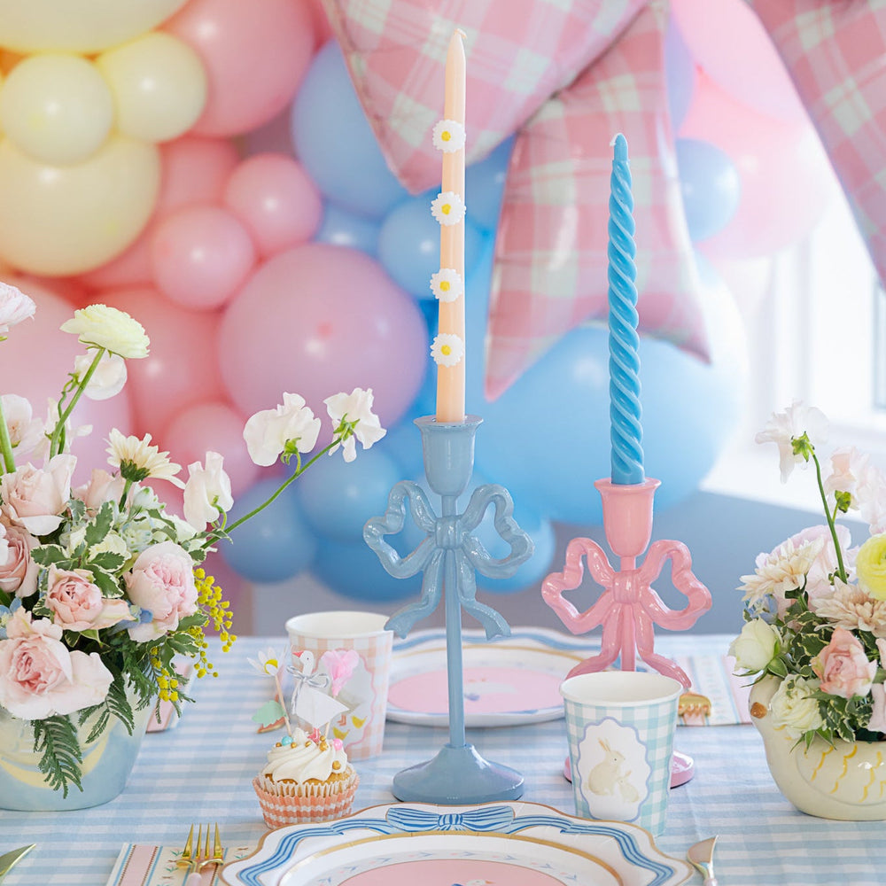 PINK BOW CANDLESTICK HOLDER  with blue taper candle Raz Valentine's Day Decor PINK BOW CANDLESTICK HOLDER Bonjour Fete - Party Supplies