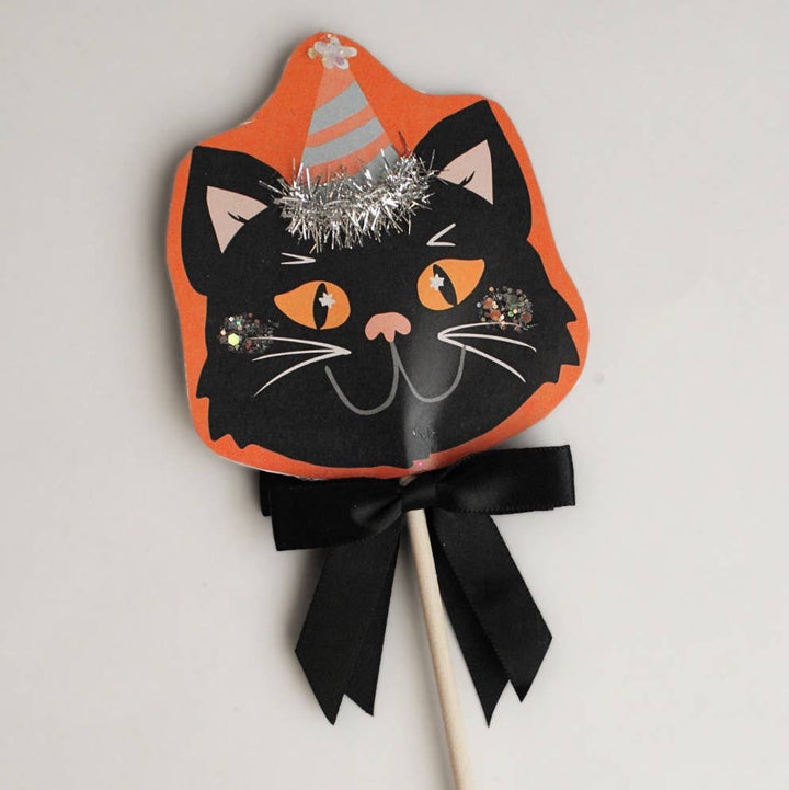 Close-up of the glittered black cat face with orange backing and tinsel crown, charming as a Halloween hostess gift