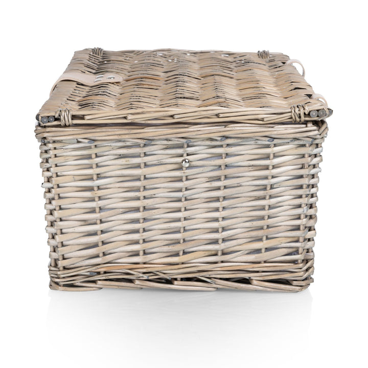 Classic picnic basket for two, carried to a park lunch or a beach evening