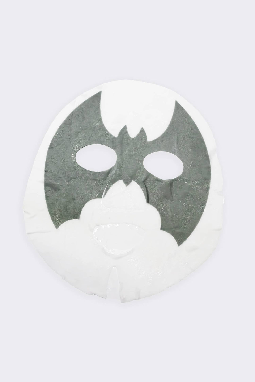 Unfolded sheet mask showing the gray bat design across the eyes, the charcoal treatment inside each Halloween pouch