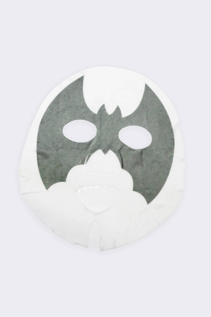 Unfolded sheet mask showing the gray bat design across the eyes, the charcoal treatment inside each Halloween pouch