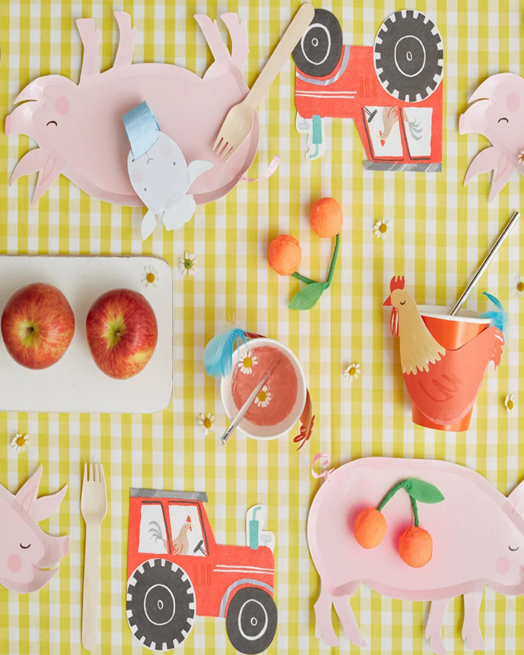 Children's table setting with farm-themed cutouts on a yellow checkered tablecloth.