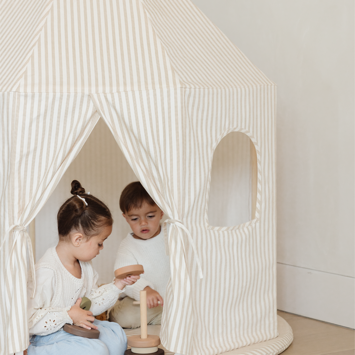 Gathre play tent styled with soft cushions for a reading corner.