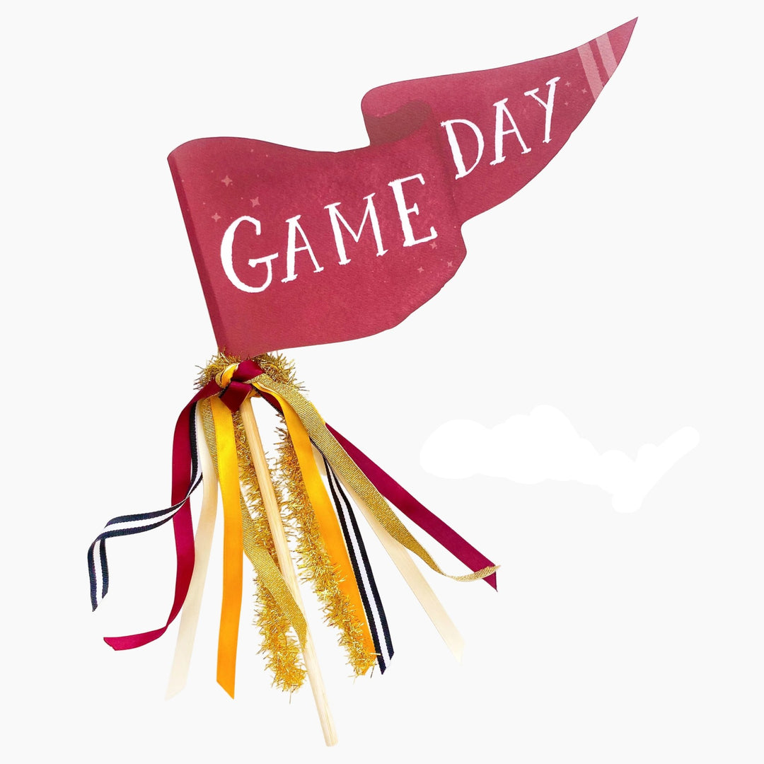 Burgundy Game Day pennant flag with burgundy, gold, navy, and cream ribbons and gold tinsel on a wood dowel