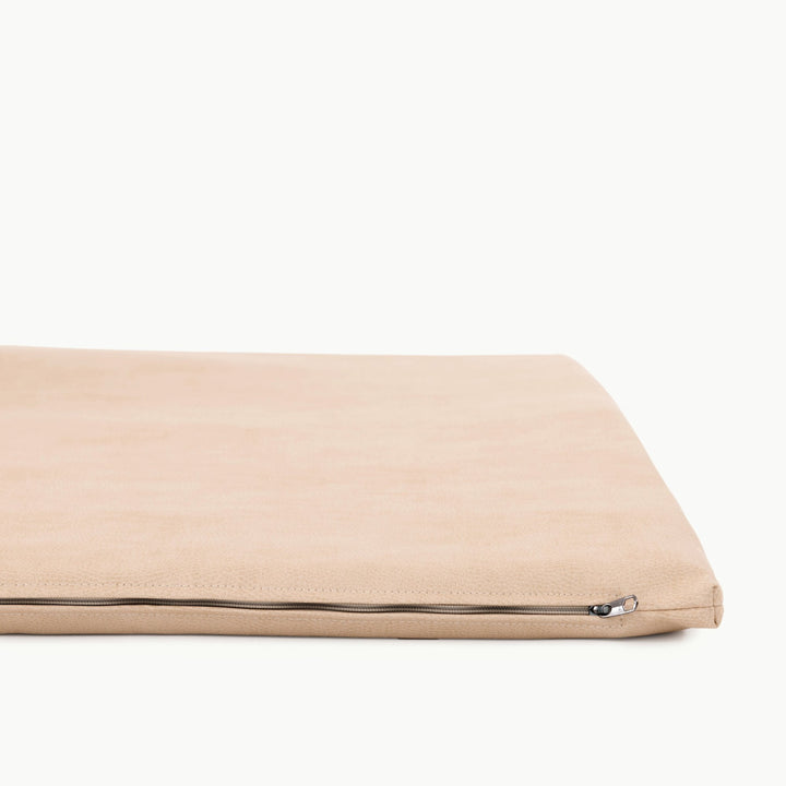 Sand suede padded play mat side view showing the zippered cushioned edge.