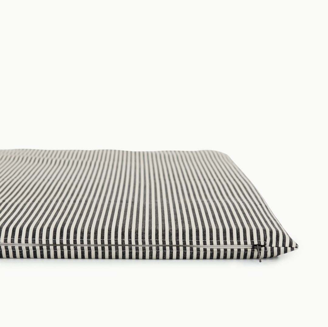 Close-up of the black and white stripe padded play mat corner