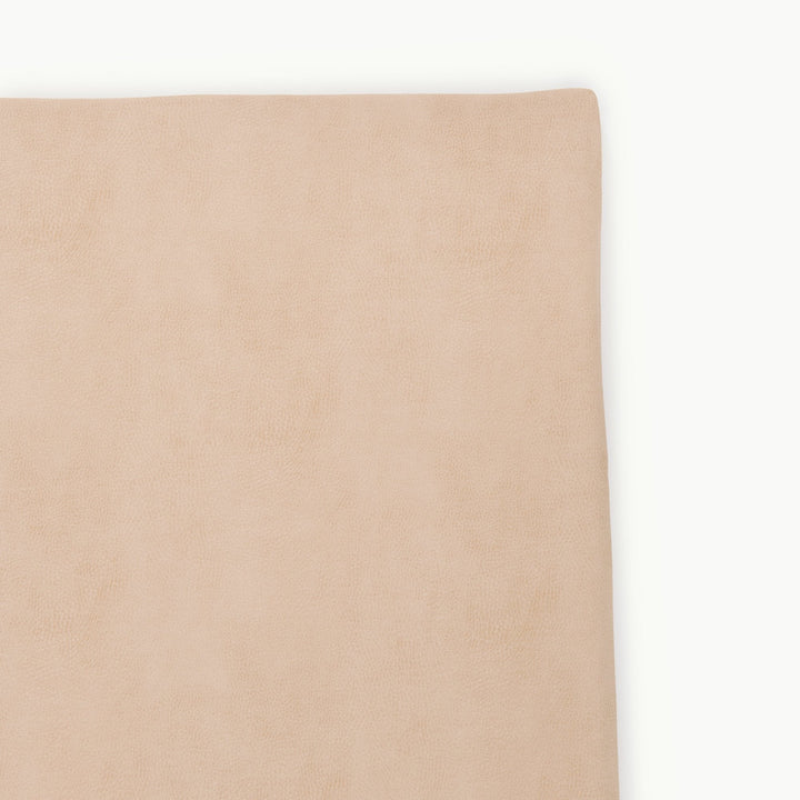Sand suede padded play mat, close-up of the soft wipeable corner.