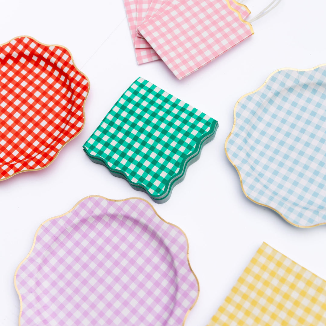 Scalloped gingham party plates and napkins in red, pink, green, lavender, blue, and yellow with gold trim