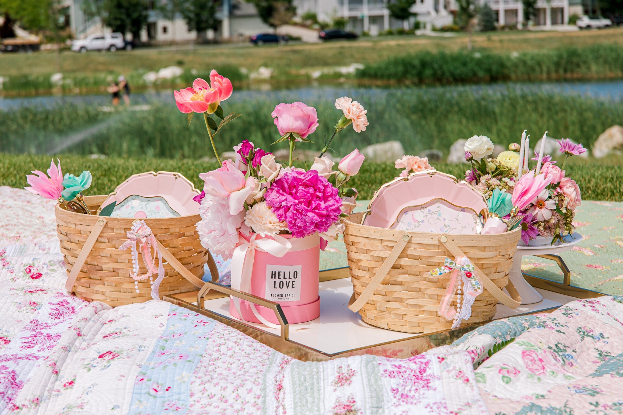 Tea supplies set our for a tea party theme birthday picnic. 