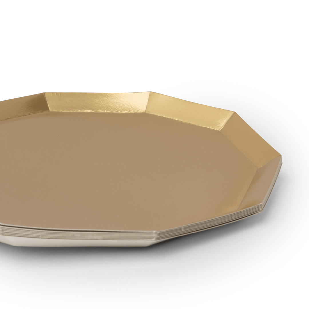 Stack of gold foil decagon party dinner plates showing the angled rim