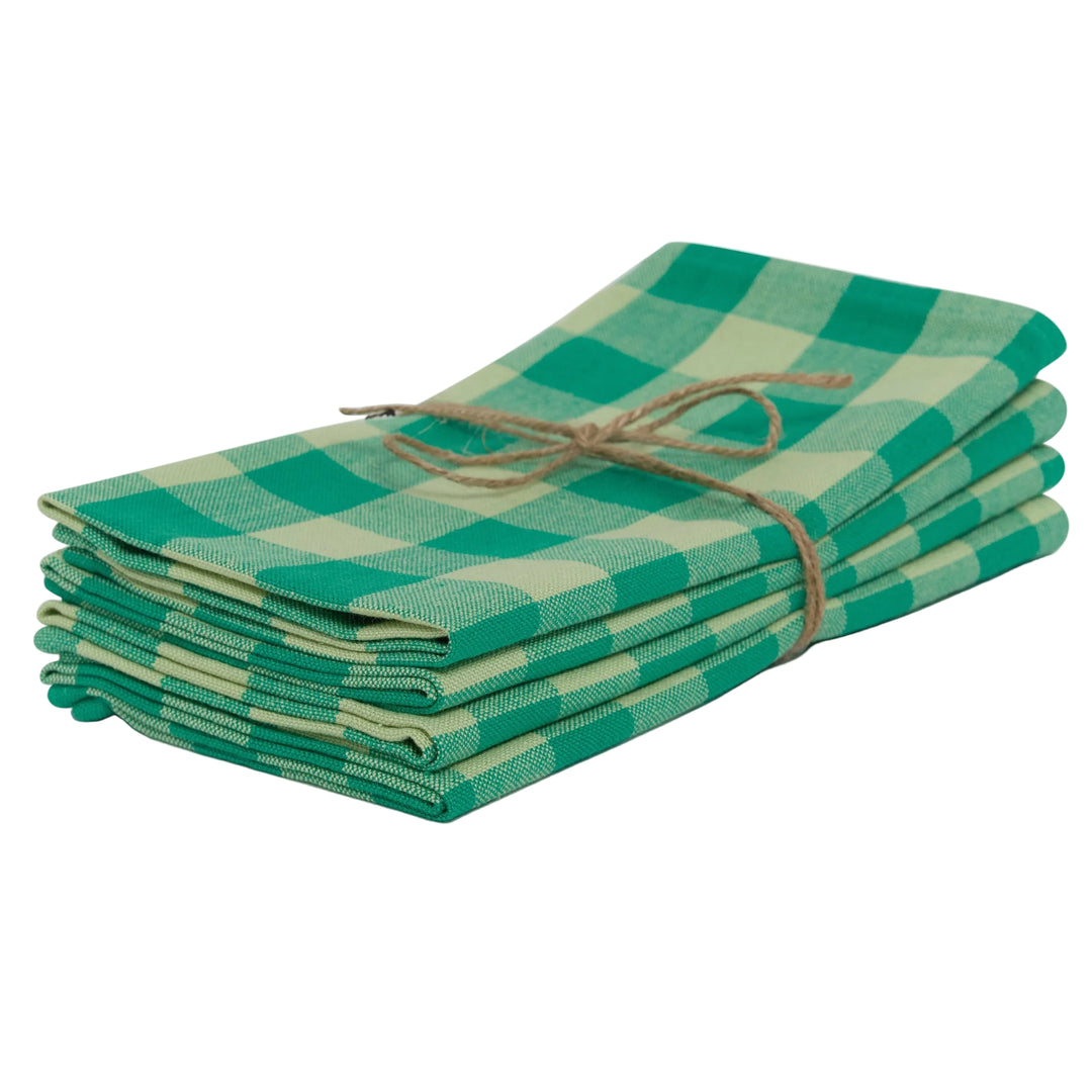 A stack of four green gingham check cloth napkins tied together with a natural jute twine bow.
