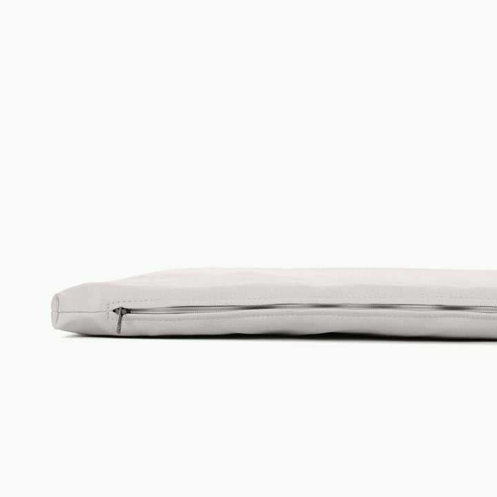 Light grey padded play mat side view showing the zippered foam insert.