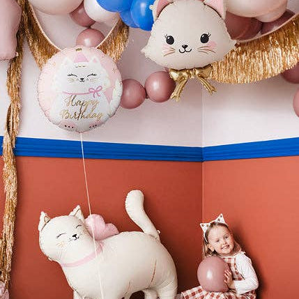 Kitty Happy Birthday balloon and white cat balloon styled with gold fringe at a girl's cat party