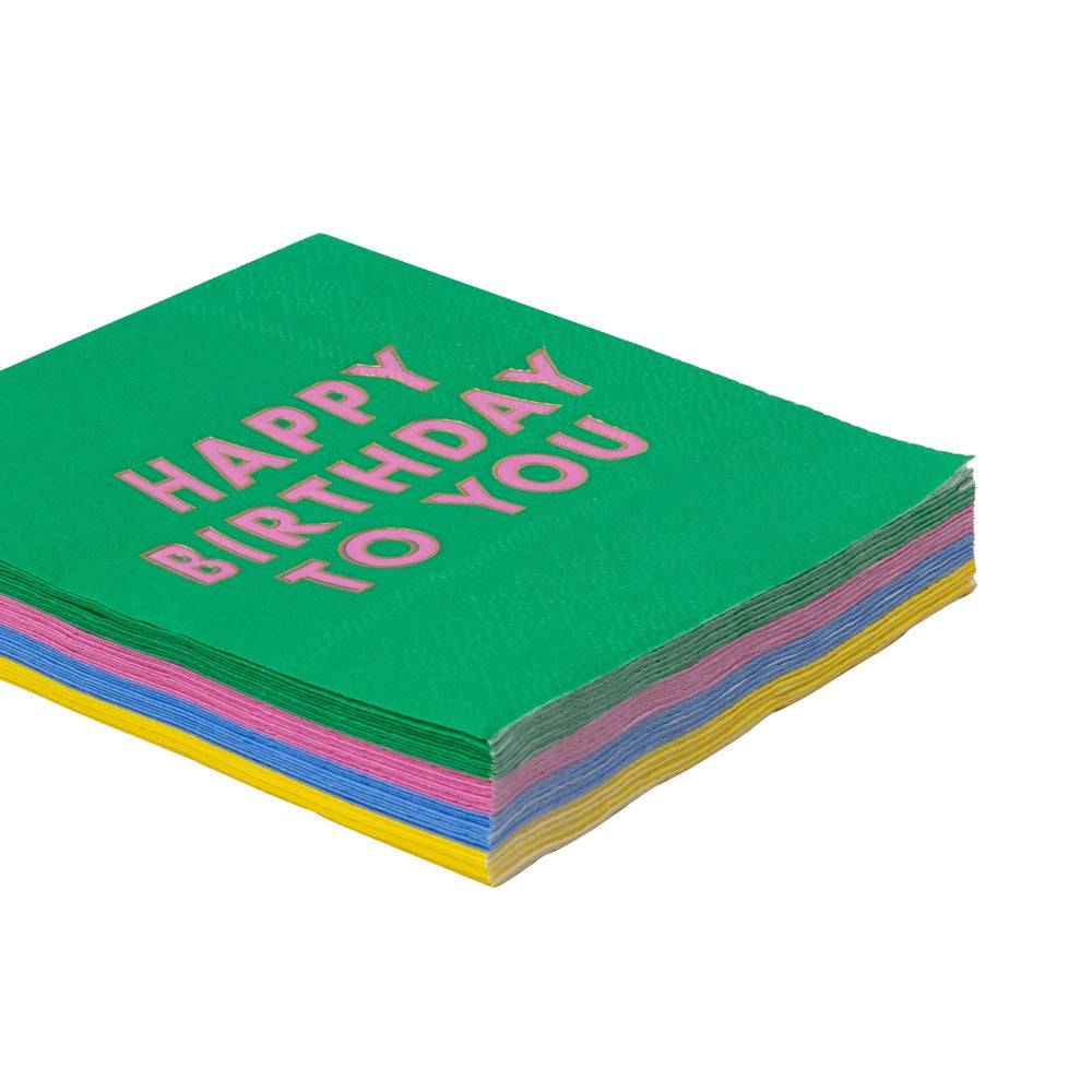 Stack of bright Happy Birthday cocktail napkins showing the multicolor designs