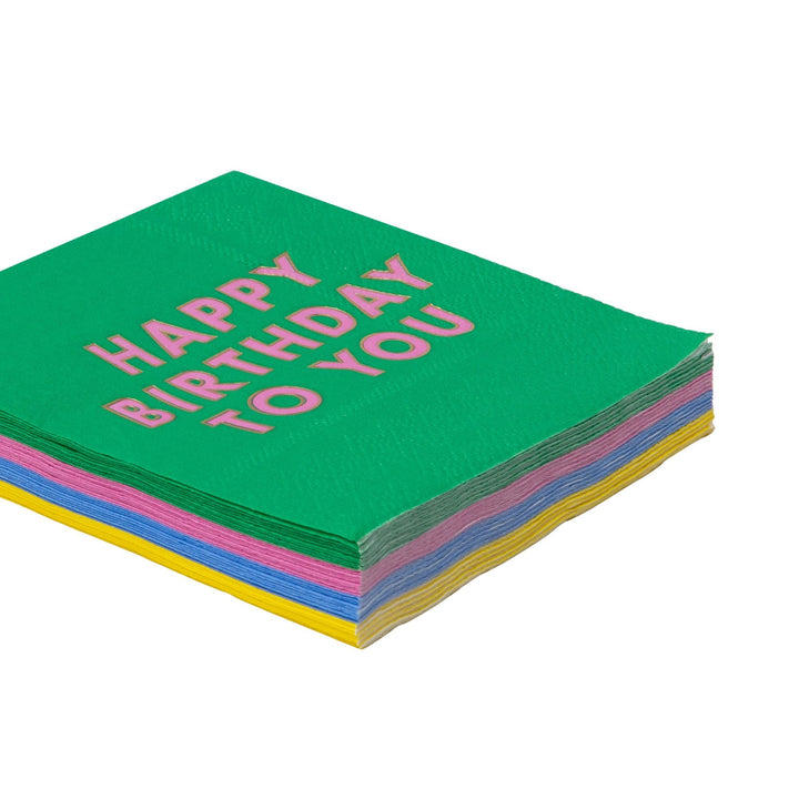 Stack of bright Happy Birthday cocktail napkins showing the multicolor designs
