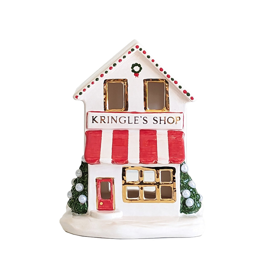 Decorative miniature building with 'Kringle's Shop' on a white background