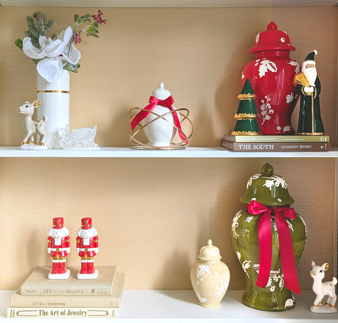 Decorative shelf with various ornaments including a red fire hydrant, green frog, and Santa Claus figurines.